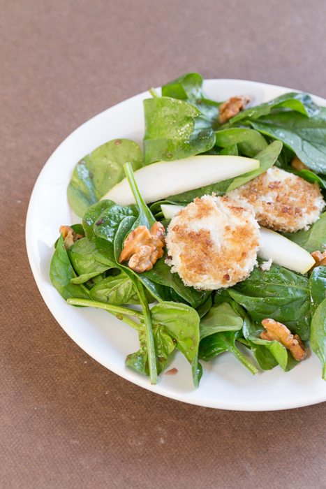 Spinach Salad with Fried Goat Cheese, Pears, Toasted Walnuts and a Pomegranate Molasses Vinaigrette