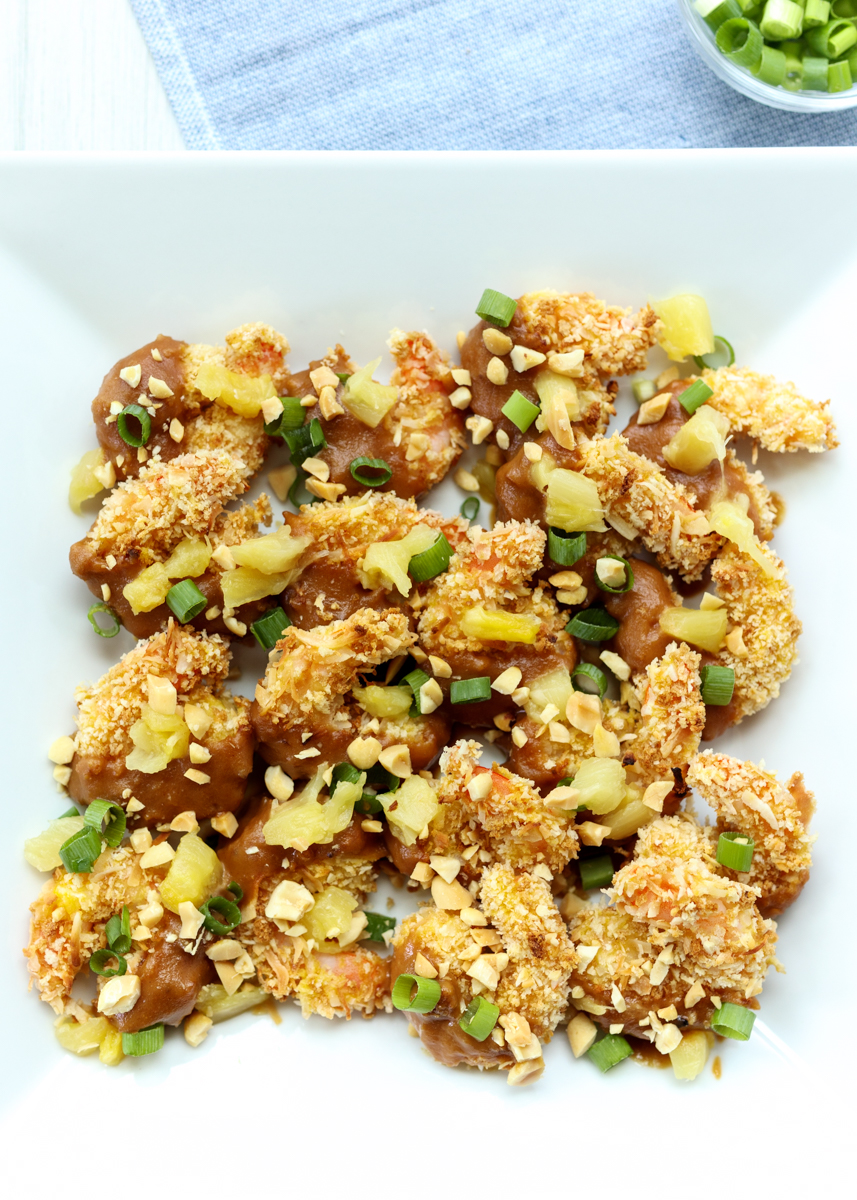 Crispy Baked Coconut Shrimp Topped with Peanut Sauce and Pineapple