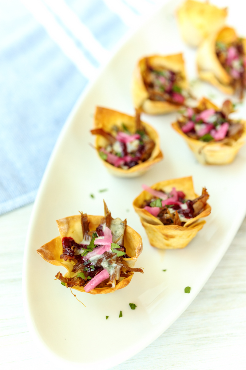 Duck Carnitas Nacho Bites with Blue Cheese and Blackberry Ale Sauce